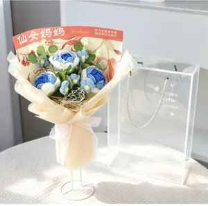Handmade crochet blue yarn flower bouquet for Mother's Day gift, elegant packaging with stand.