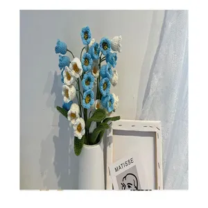 Handmade crochet blue white lily of the valley flower bouquet detail view, creative gift.