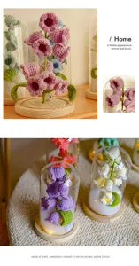 Handmade crochet flower night light with glass dome and wooden base for cozy home decor.