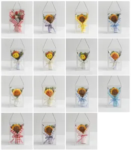 Handmade crochet sunflower and strawberry bouquets in clear gift boxes for events.
