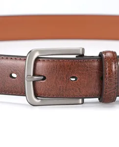 Men's vintage brown leather belt detail shot featuring a stylish brushed metal pin buckle.