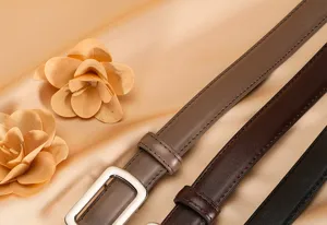 Close-up detail view of minimalist women's genuine leather belts in classic colors.