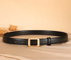 Elegant black leather belt with a stylish gold geometric buckle for women, perfect for jeans.