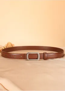 Brown leather belt detail shot featuring a sleek silver rectangular metal buckle.