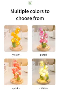 Crocheted lily of the valley night light color variants showcase, glass dome and wooden base.