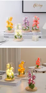 Handmade crochet lily flower night light with glass dome and wood base for cozy room decor.