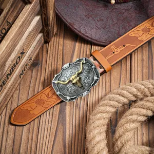 Western cowboy vintage men embossed leather belt bull head alloy buckle detail closeup view