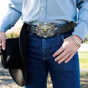 Detailed close-up shot of the vintage western bull head alloy buckle embossed leather belt.