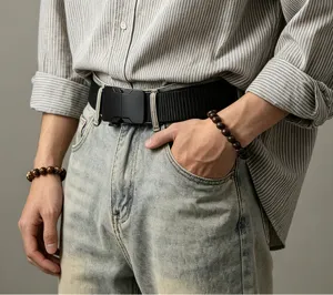 Close-up detail shot of men's tactical belt with alloy buckle and elastic webbing style.