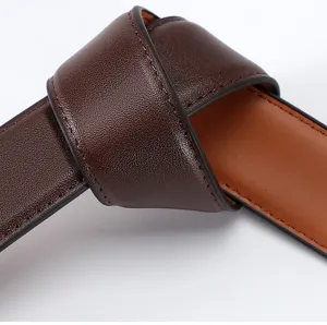 Closeup detail of men's dark brown leather belt showing fine texture and neat stitching.
