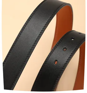 Close-up of premium black leather belt with contrast brown inner lining and clean stitching detail.