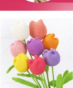 Close up view of handmade crochet tulip bouquet with colorful wool yarn flowers and green stems.