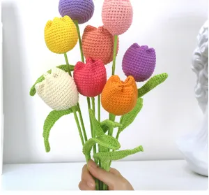 Handmade crochet tulip bouquet detail, colorful wool knitted artificial flowers for sweet gift.