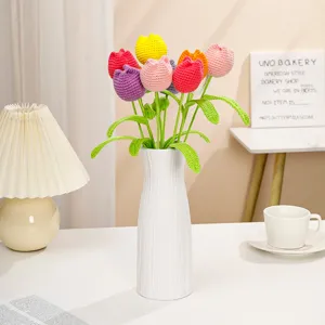 Handcrafted crochet tulip bouquet in white vase, colorful knitted flower gift for home decor.