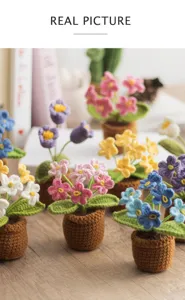 Handmade crochet potted flower detail shot, cute mini yarn floral ornament for car decor.
