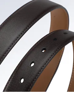 Detailed view of the luxury brown leather men belt with perforated holes and fine texture.