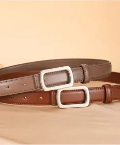 Detail view of women's genuine leather belt with sleek rectangular metal buckle for daily style.