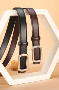 Detail view of women's leather belt, silver rectangular buckle, fine stitching design.