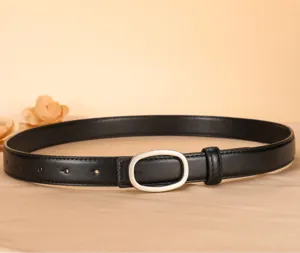 Detail view of women's black genuine leather skinny belt with elegant oval buckle for jeans.