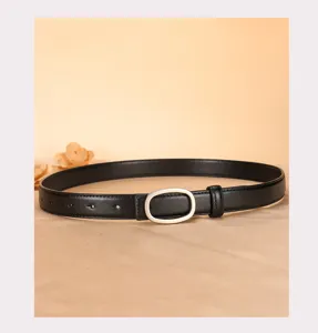 Classic women black leather belt with silver oval buckle, elegant accessory for jeans and pants.