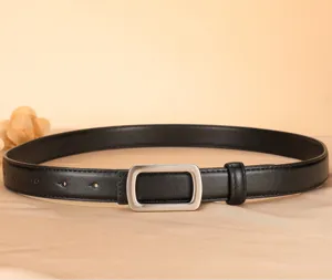 Detailed close-up of a classic black leather belt featuring a sleek silver rectangular metal buckle.