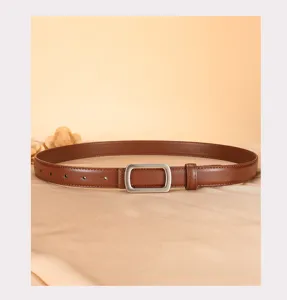 Detail view of elegant brown leather belt with a sleek silver rectangular buckle for daily wear.