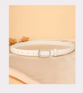 Close-up of white leather women's belt detail with silver buckle and smooth draped fabric.