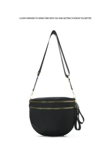 Black nylon shell crossbody bag for women, versatile everyday shoulder bag with gold zippers.