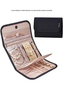 Detailed view of portable folding jewelry organizer bag with multiple compartments for travel.