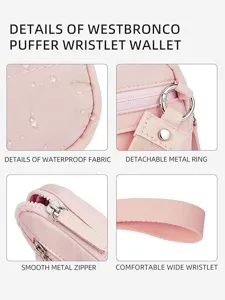 Detailed view of the pink puffer wristlet wallet featuring waterproof fabric and zipper.