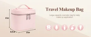 Pink leather travel makeup bag with large capacity, portable handle and secure zippers for use.