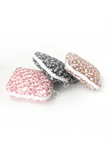 Petite pochette zippée à fleurs portable pour serviettes hygiéniques et monnaie.