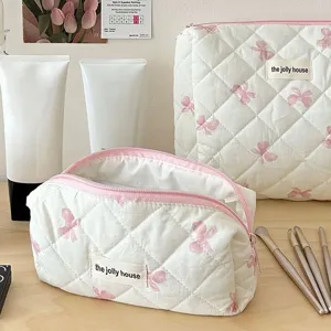Quilted makeup bag with cute pink bow pattern, large capacity portable cosmetic storage bag.