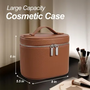Detail view of the brown leather cosmetic case showing spacious interior and fine texture.