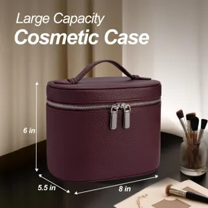 Large capacity cosmetic case in luxury litchi pattern leather with secure zipper and handle.