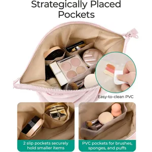 Detailed view of the pink cosmetic bag showing multiple interior pockets and easy-to-clean PVC.