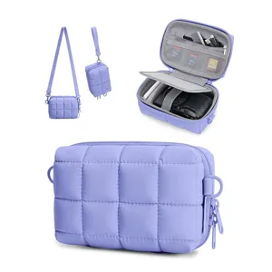 Waterproof quilted camera shoulder bag with padded storage, multi compartments for travel.