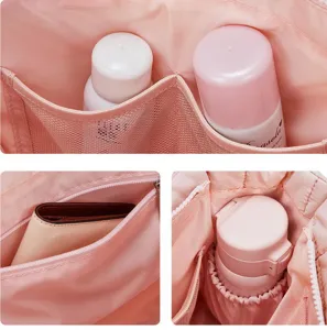 Pink tote bag interior detail view featuring multiple mesh pockets and storage compartments for daily use.