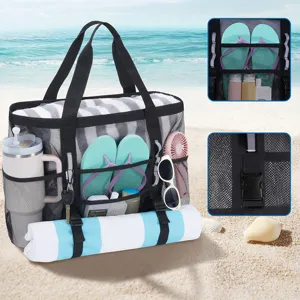 Large mesh beach bag detail view showing multiple compartments, durable straps, and side pockets.