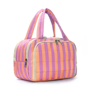 Striped toiletry bag detail showing double zipper wide opening and quilted texture.
