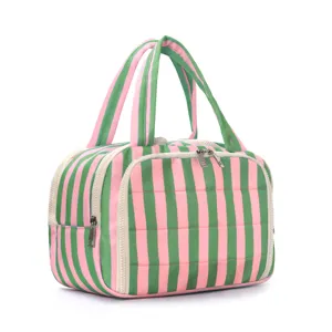Close-up of pink and green striped cosmetic bag, wide opening detail and dual zippers.
