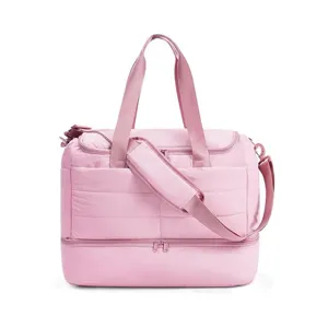 Quilted pink travel duffel bag with separate bottom compartment for women. Lightweight.