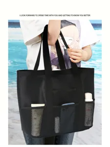 Large capacity black mesh beach bag, durable tote handbag with multiple outer pockets for swimming travel.