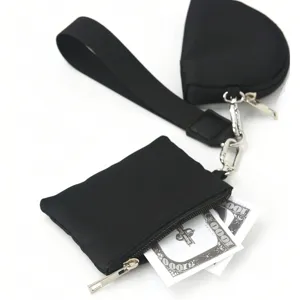 Black multi-piece wristlet pouch and coin purse set with key chain and strap, main view.