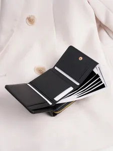 Women black tri fold wallet with card slots and zipper coin pocket for daily use style.
