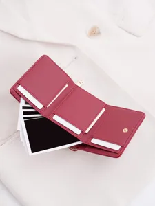 Detailed close-up of the multi-slot trifold wallet showing interior card holders and coin pocket design.