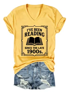 Detail view of the yellow V-neck short sleeve T-shirt featuring 'Reading' graphic print.