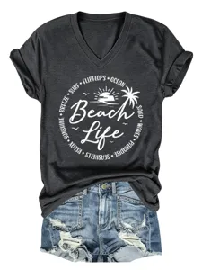 Detail view of women's dark grey V-neck beach life graphic print short sleeve T-shirt with shorts.