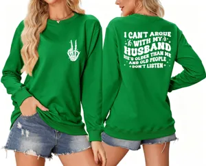 Green sweatshirt detail showing funny back slogan print and cute skeleton chest graphic.