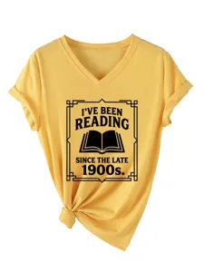 Detailed view of the yellow V-neck short sleeve t-shirt with book print and knotted hem.